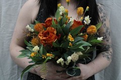 Burnt orange floral bouquet w/ boutonnierre