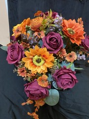 Burnt Orange And Magenta Bouquet In A Holder with Matching Boutinnier