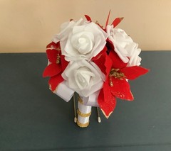 Red poinsettia and rose wedding bouquet