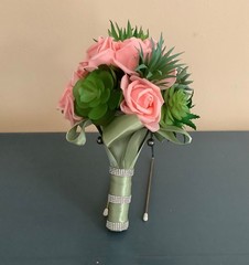 Artificial succulents and pink champagne roses wedding bouquet