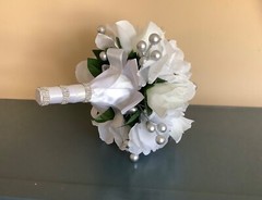 White roses, white rosebuds and silver berries bridal bouquet