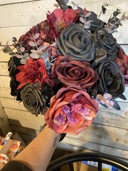 Black and burgundy Hand tied wedding bouquet with matching boutonnière.