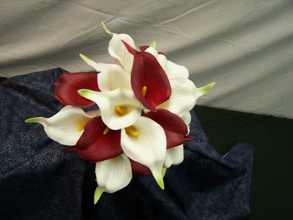 Red and white calla lily floral bouquet with matching boutonnierre