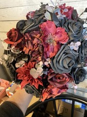 Black and burgundy Hand tied wedding bouquet with matching boutonnière.