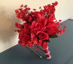 Red roses, rosebuds and red baby’s breath bridal bouquet