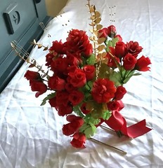 Red rosebuds, red blooms, gold eucalyptus and gold crystals bridal bouquet
