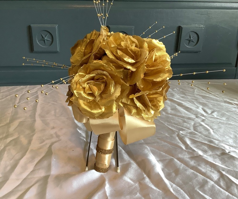 Gold colored roses and crystal bridal bouquet