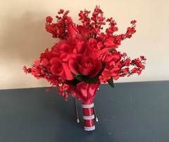 Red roses, rosebuds and red baby’s breath bridal bouquet