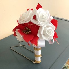 Red poinsettia and rose wedding bouquet