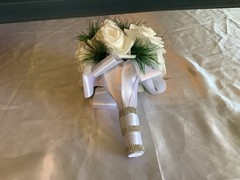 Winter pine and real touch rose bouquet