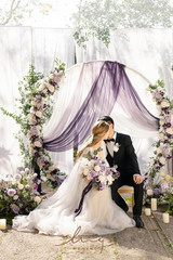 Elegant Purple & Gold Wedding Arch Flowers with Sheer Drapes – 5-Piece Set