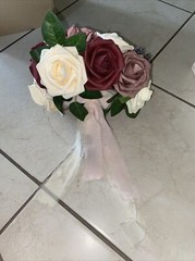 bouquet with burgundy, cream and pink colored flowers