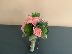 Artificial succulents and pink champagne roses wedding bouquet