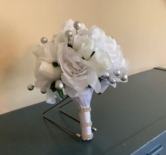 White roses, white rosebuds and silver berries bridal bouquet