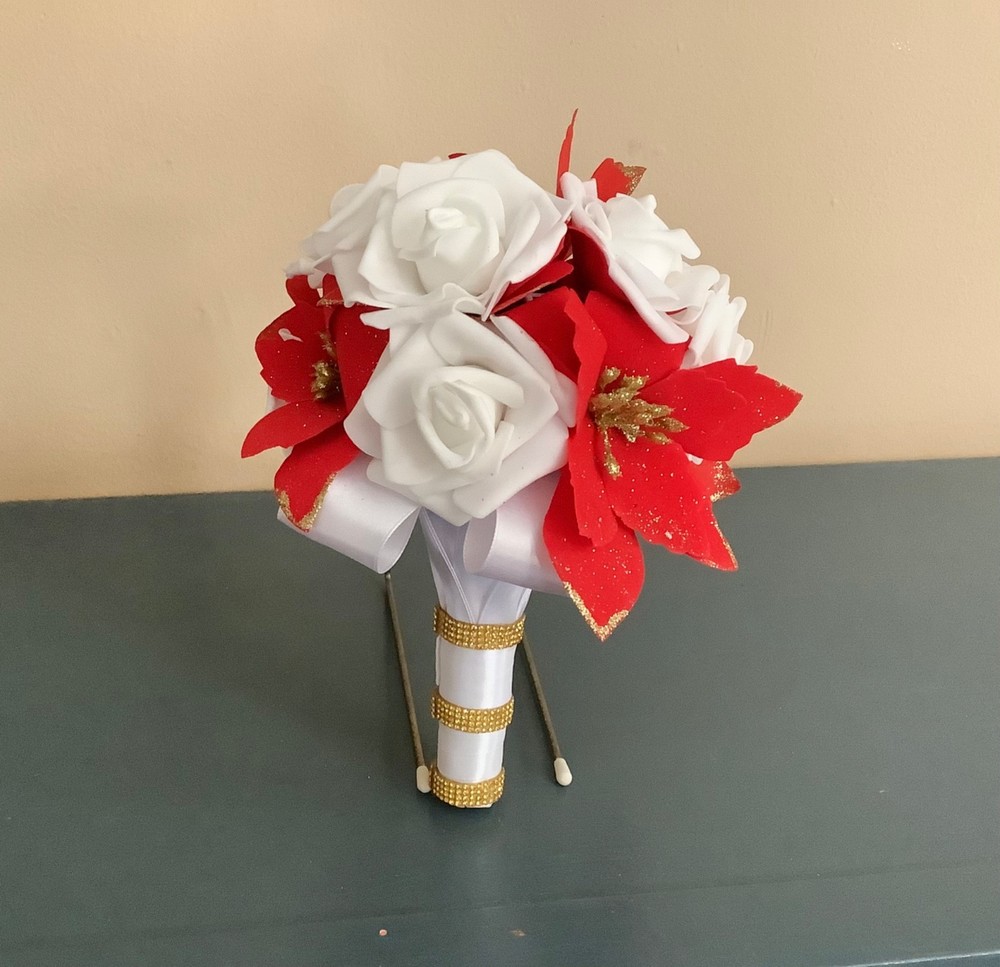 Red poinsettia and rose wedding bouquet