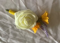Ivory rose, lavender and yellow daisy boutonniere