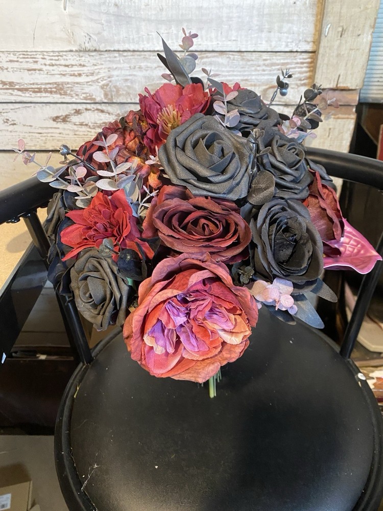 Black and burgundy Hand tied wedding bouquet with matching boutonnière.