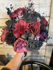 Black and burgundy Hand tied wedding bouquet with matching boutonnière.
