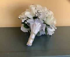 White roses, white rosebuds and silver berries bridal bouquet