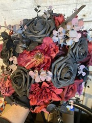 Black and burgundy Hand tied wedding bouquet with matching boutonnière.