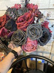 Black and burgundy Hand tied wedding bouquet with matching boutonnière.