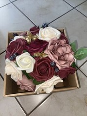 bouquet with burgundy, cream and pink colored flowers
