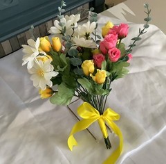 Pink and yellow rosebud with daisies and eucalyptus bridal bouquet