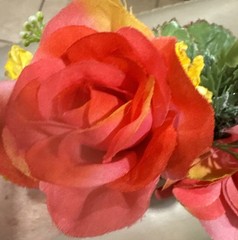 Wrist Corsage Made With Coral Roses & Yellow Filler. Perfect For Prom.