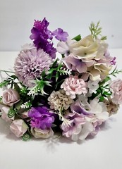 Wedding bouquet. Artificial flowers accessory with pearls and ribbons