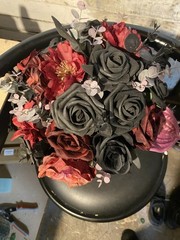 Black and burgundy Hand tied wedding bouquet with matching boutonnière.