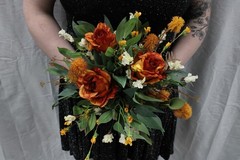 Burnt orange floral bouquet w/ boutonnierre