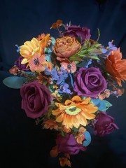 Burnt Orange And Magenta Bouquet In A Holder with Matching Boutinnier