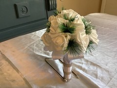 Winter pine and real touch rose bouquet