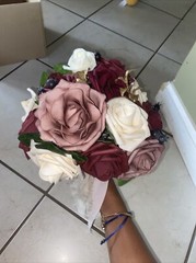 bouquet with burgundy, cream and pink colored flowers