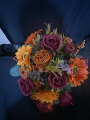 Burnt Orange And Magenta Bouquet In A Holder with Matching Boutinnier