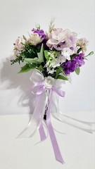 Wedding bouquet. Artificial flowers accessory with pearls and ribbons