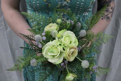 Light green rose & ranunculus w/ lavendar hints w/ matching boutonniere