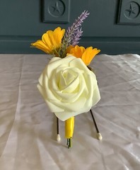 Ivory rose, lavender and yellow daisy boutonniere