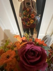 Burnt Orange And Magenta Bouquet In A Holder with Matching Boutinnier