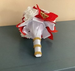 Red poinsettia and rose wedding bouquet