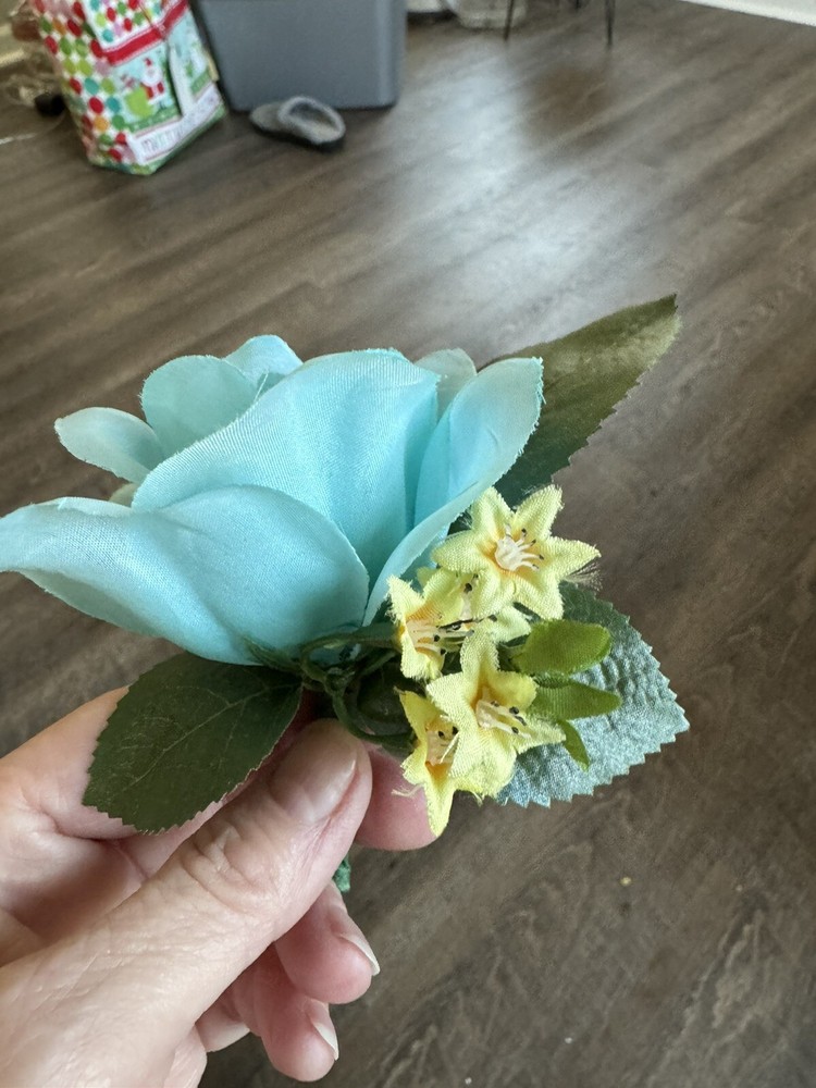 Silk Boutonnière Made With A Turquoise Rose With Yellow Filler. Perfect For Prom