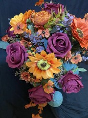 Burnt Orange And Magenta Bouquet In A Holder with Matching Boutinnier
