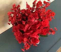 Red roses, rosebuds and red baby’s breath bridal bouquet