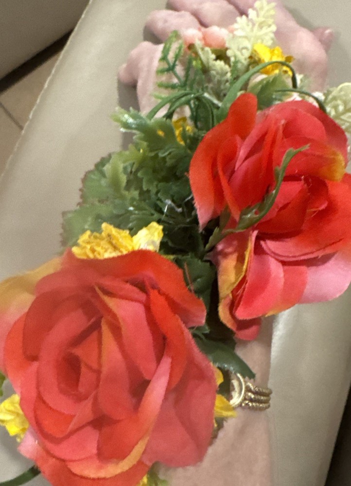 Wrist Corsage Made With Coral Roses & Yellow Filler. Perfect For Prom.