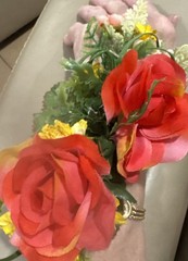 Wrist Corsage Made With Coral Roses & Yellow Filler. Perfect For Prom.