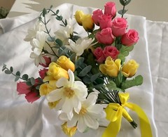 Pink and yellow rosebud with daisies and eucalyptus bridal bouquet