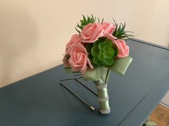 Artificial succulents and pink champagne roses wedding bouquet