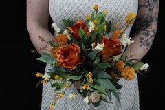 Burnt orange floral bouquet w/ boutonnierre