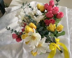 Pink and yellow rosebud with daisies and eucalyptus bridal bouquet