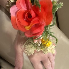 Wrist Corsage Made With Coral Roses & Yellow Filler. Perfect For Prom.